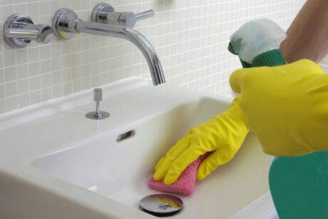 cleaning-bathroom-sink-GettyImages-dv1449036-566b487a3df78ce16163bfba